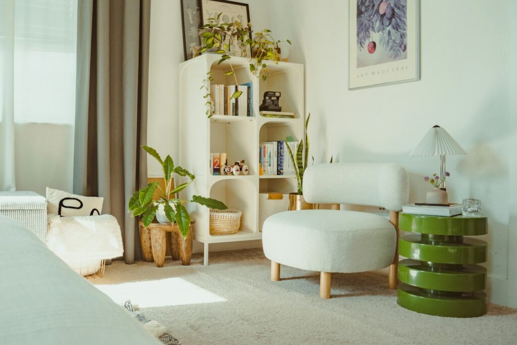 Bright, cozy room with plants and a white chair